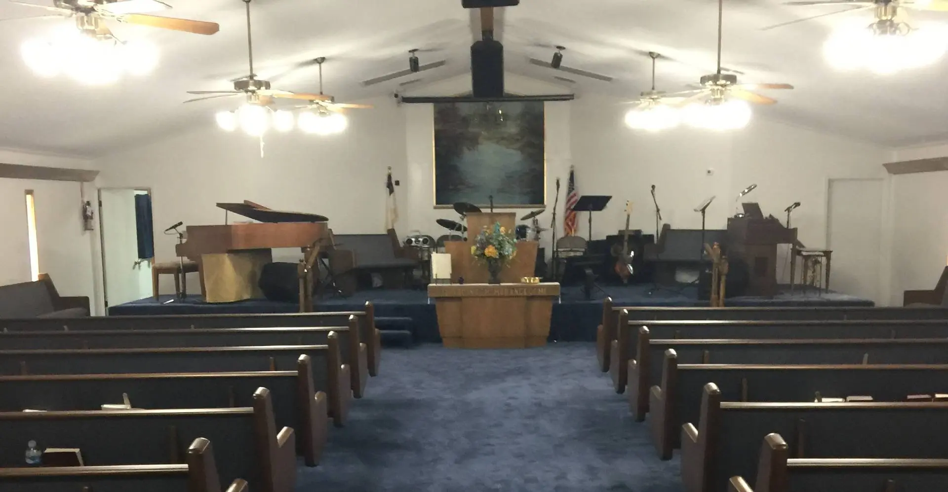 A church with pews and a large stage